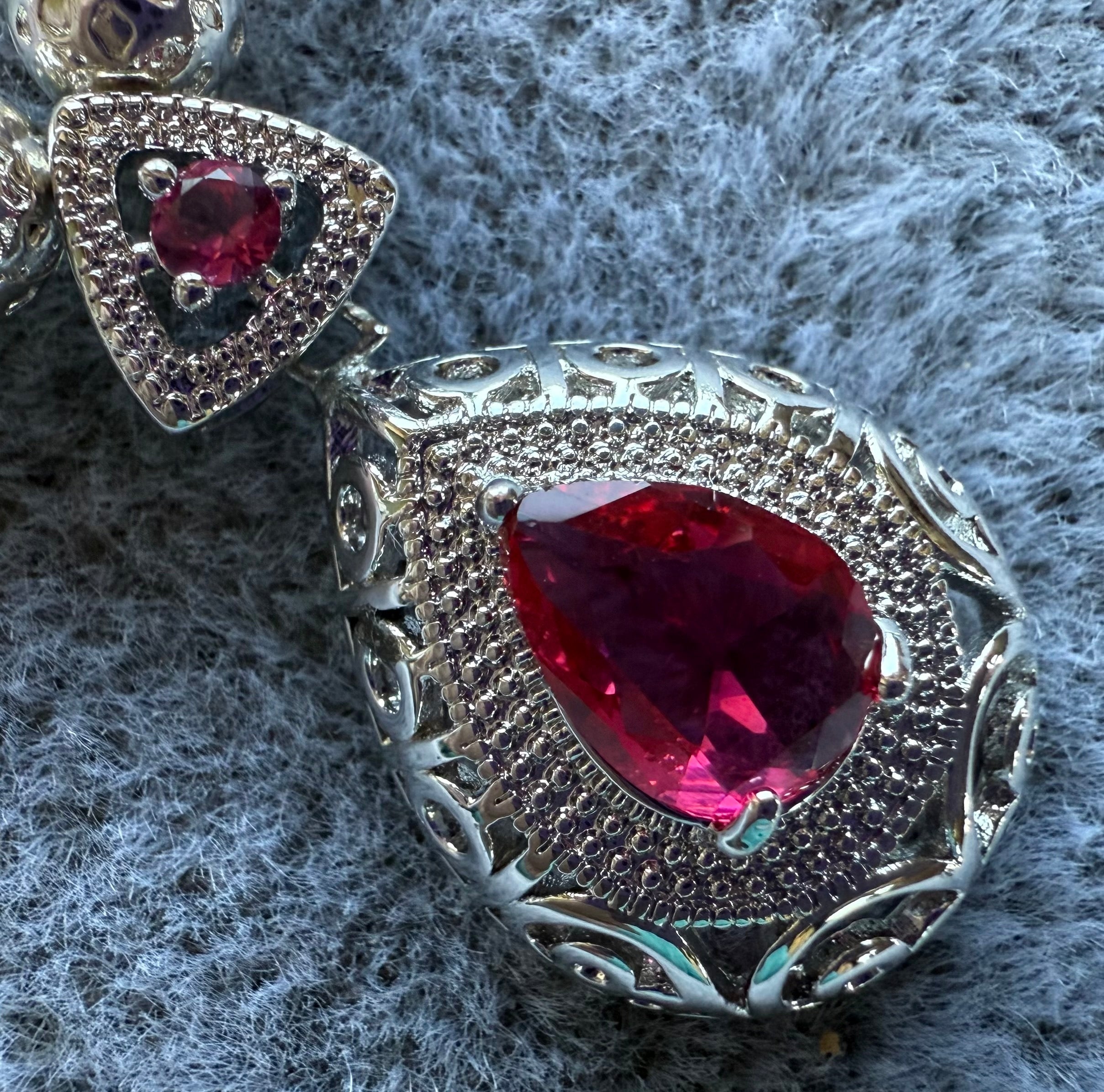 104  Ruby And Silver Pendant Necklace And Earrings