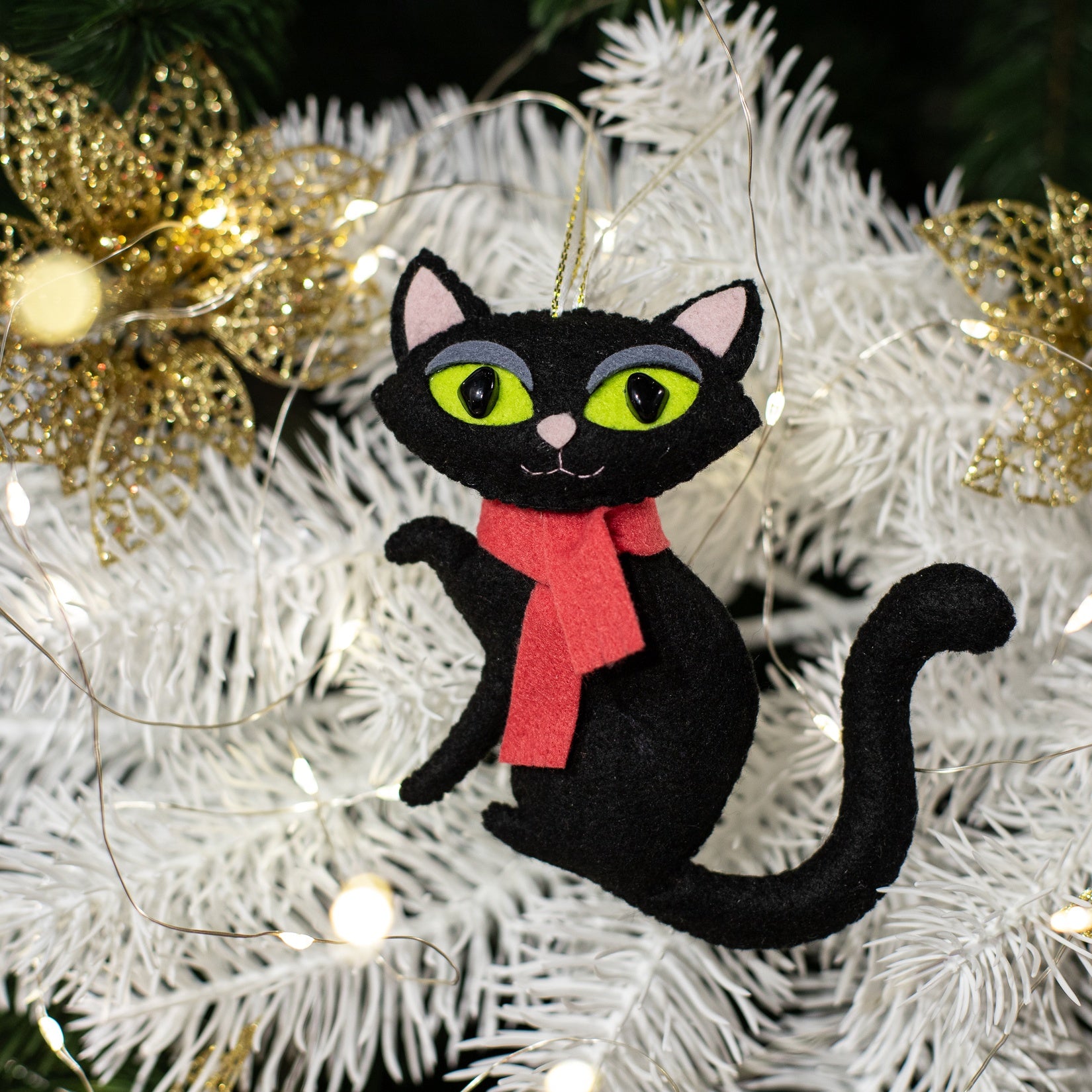 Felt black cat ornament, with big green eyes and der scarf